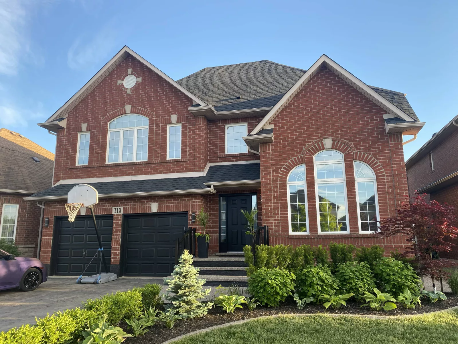 Commercial window film installation on a bright Hamilton space